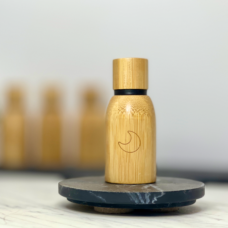 15ml of Sleep Blend Pure Essential Oil encased in bamboo reflecting eco-friendly elegance.